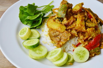 stir fried wild boar with red curry on rice