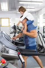 Fototapeta premium father and son do sports in the gym