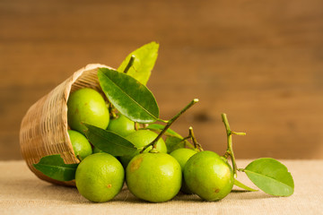 Green lemon in the basket