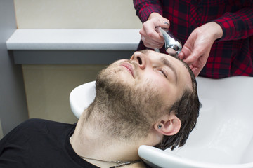 The young man at the hairdresser salon hairstyle make model