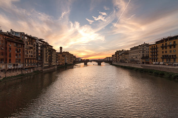 Fototapeta premium Sunset in Florence, Tuscany, Italy. Scenic view of the citi from the bridges over Arno river