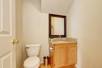 Small bathroom interior with toilet and vanity unit