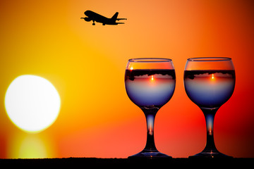 Glass of white vine with reflections of houses and view to beaut