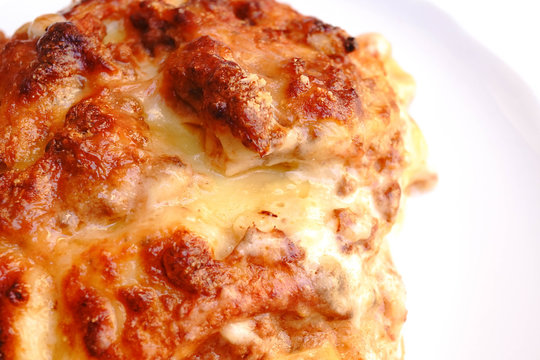 Italian lasagna, closed up of lasagna on white dish