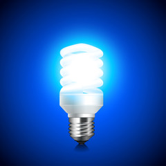 Energy saving light bulb glowing on dark background vector