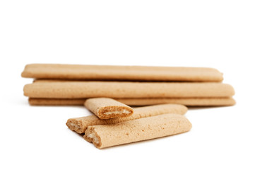 
Biscuit sticks with filling on white background