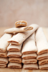 Biscuit sticks with filling on a wooden surface