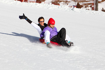Mother and her daughter enjoying sleigh ride.