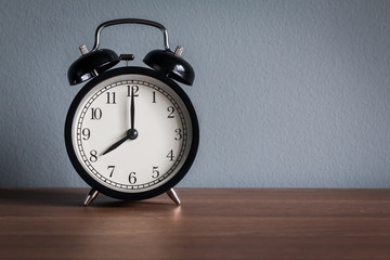 Still life with vintage alarm clock on wood table ( alarm clock
