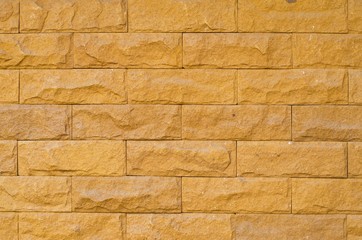 Sandstone brick wall background and textures.