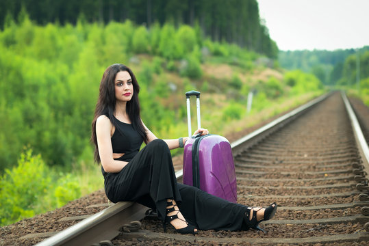 Brunette woman waiting for train