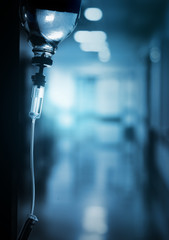 Drip in hospital on the background of dark empty corridor