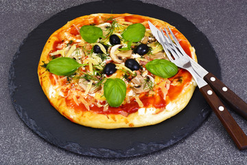 Pizza with Mushroom, Cheese, Mozzarella, Olives and Basil 