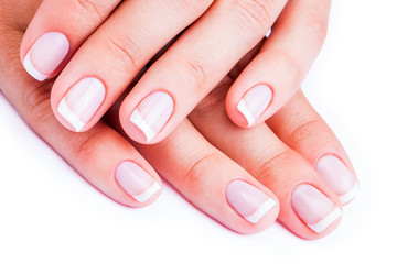 Woman hands with french manicure isolated on a white background