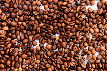 Coffee beans on wood background