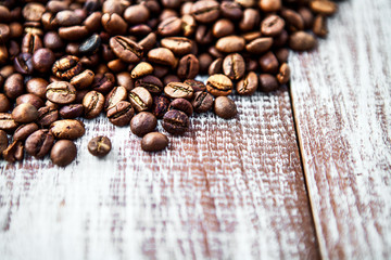 Coffee beans on wood background