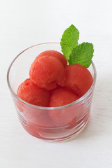 Watermelon balls in glass bowl with mint