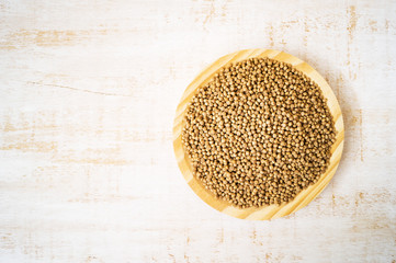 Giant wholegrain couscous on wooden plate