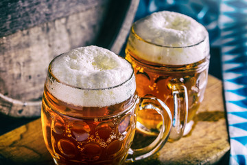 Beer. Oktoberfest.Two cold beers. Draft beer. Draft ale. Golden beer. Golden ale. Two gold beer with froth on top. Draft cold beer in glass jars in pub hotel or restaurant. Still life.