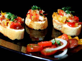 Bruschetta with different varieties of tomatoes