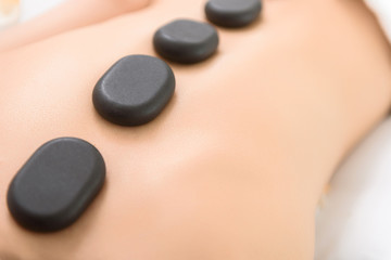 Young woman getting massage at beauty salon