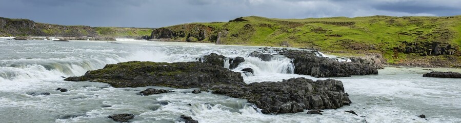 Fototapeta na wymiar panorama of wild river with stones in Iceland