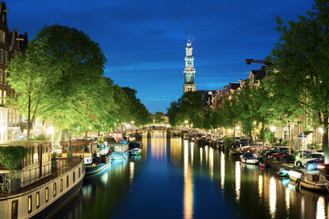 Fototapeta premium Westerkerk church tower at canal in Amsterdam, Netherlands