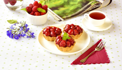 Fruit raspberry tart cakes on a table