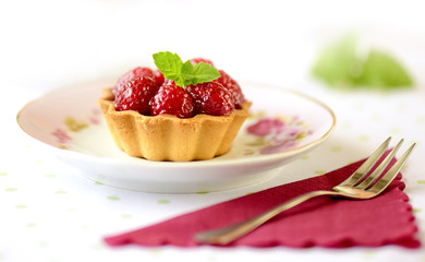 Fruit raspberry tart cakes on a table
