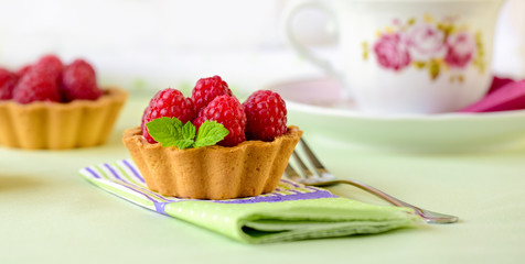 Fruit raspberry tart cakes on a table