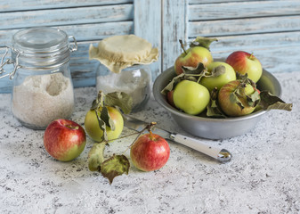 Fresh garden apples in a bowl on wooden rustic background. Rustic and vintage still life