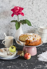 Homemade apple pie on a light background. Tea party table. Still life in vintage and rustic style.