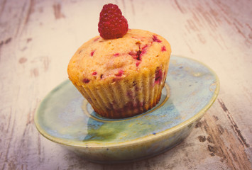Vintage photo, Fresh baked cupcake with raspberries and chocolate, delicious dessert