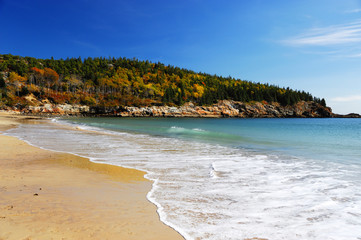beach and sea near autumn hill