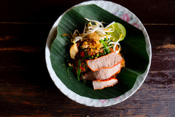 Egg dry noodles with roast red pork, lemon and soup