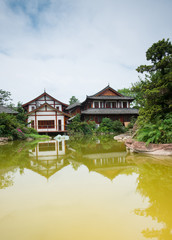 Fototapeta na wymiar traditional chinese building by the lake,chongqing,china