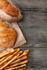 Fresh breads on wood background