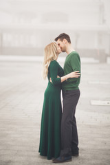 Happy couple on the pier, young family in love spending honeymoon vacation luxury islands