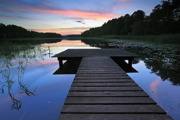Lake surrounded by Forest at Sunset, Wooden Pier