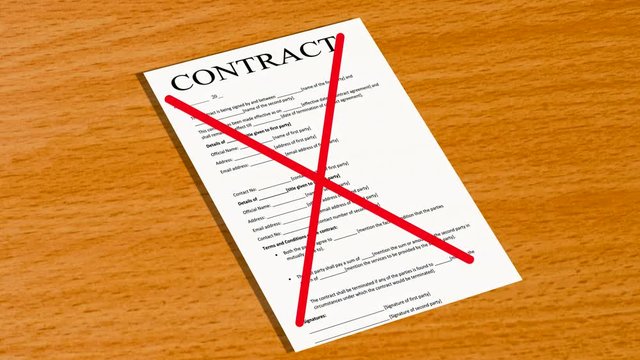 Two red lines cross out the contract that is on the table
