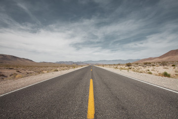 panoramic view of nice road coming through the deatn valley