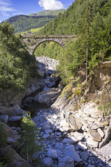 Little Creek in the European Alps with Bridge