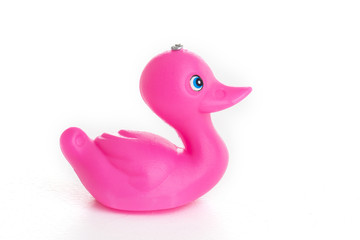 Pink duck toy on white background 