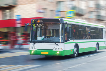 bus goes along street
