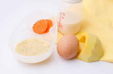 Fresh, various kinds of baby food in plastic bowls. Shot for a s