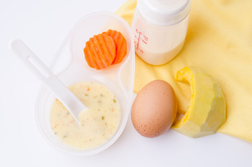 Fresh, various kinds of baby food in plastic bowls. Shot for a s