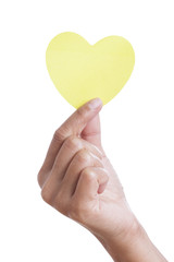 Fototapeta premium A female hand holding paper heart, isolated on white. with using path