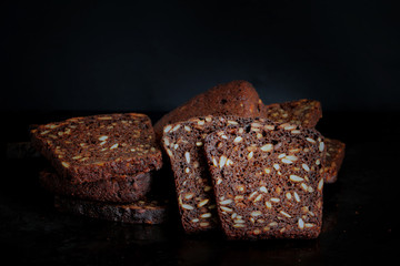 Sliced rye bread on black background, Special light.