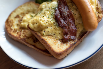 omelette and French toast served with bacon and sausage