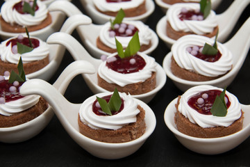  mini cakes with cherry filling and cream in white cup